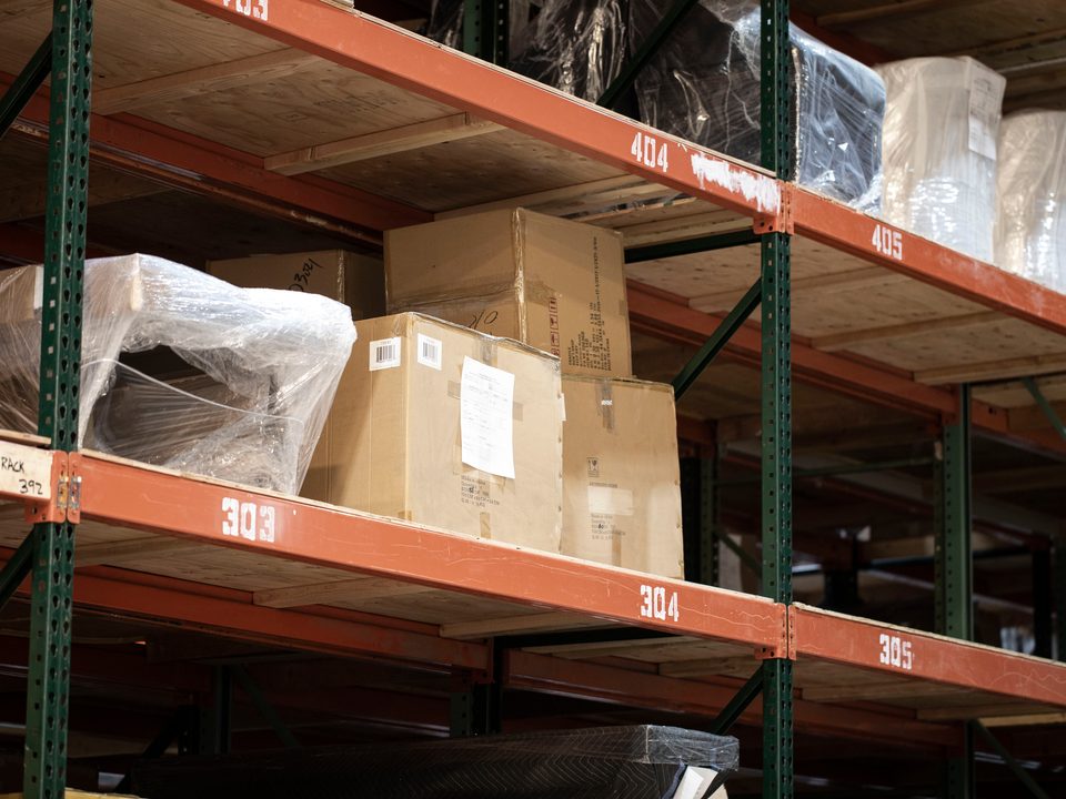 Wrapped pieces and cartons on numbered warehouse racking