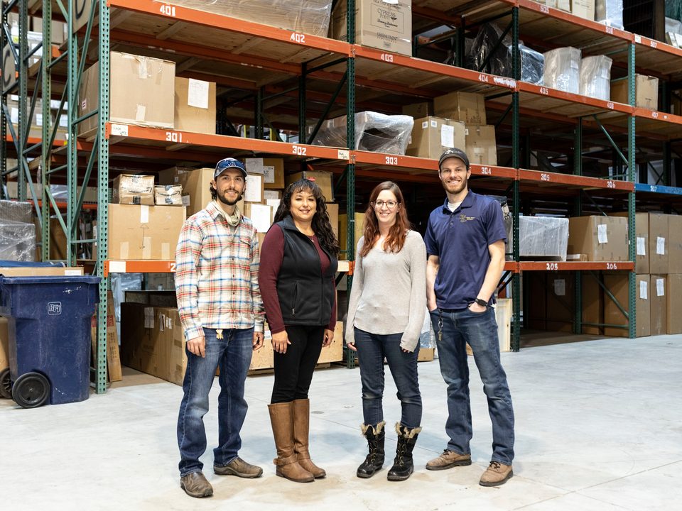 The White Horse team in the storage warehouse